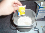 Dump the yeast into the bread mix next.